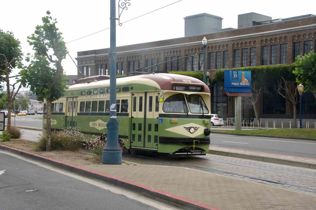 Legacy streetcar running in front of Fisherman's Wharf.