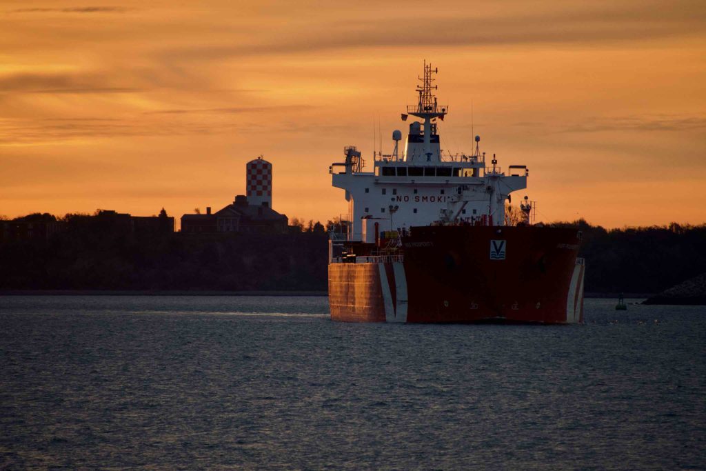 Tanker making the turn in the channel at sunrise