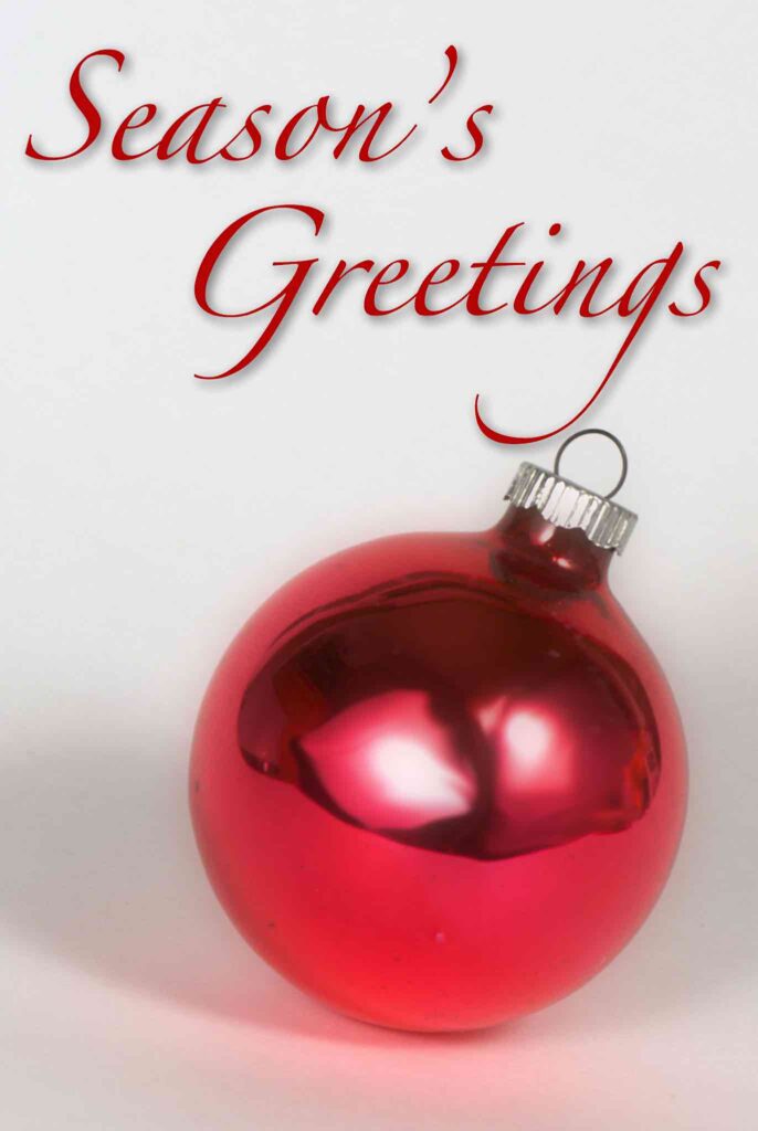 Plain red glass ornament with the words 'Season's Greetings' above