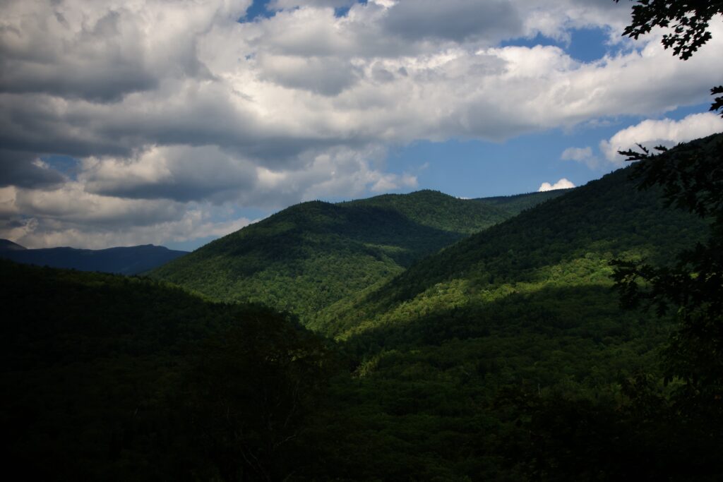 Clouds and shadows playing across mountain