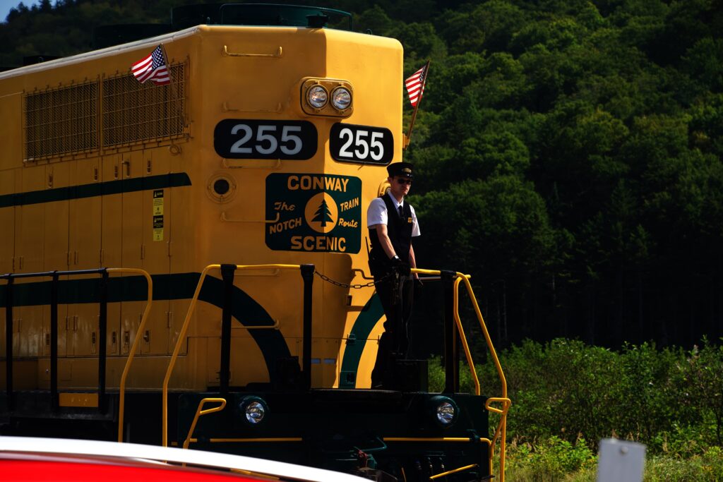 Trainman guiding the locomotive as it recouples to the other end