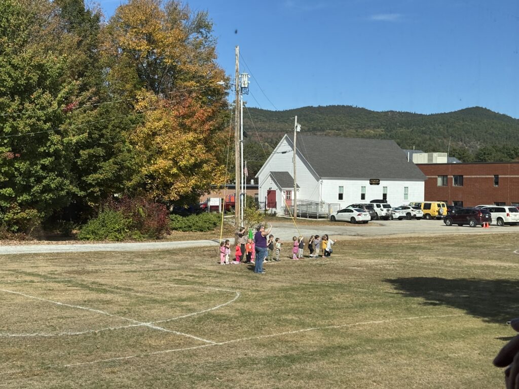 Children waving at the train