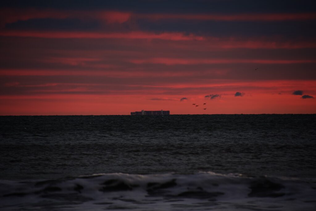 Container ship at sea. Only the containers are visible