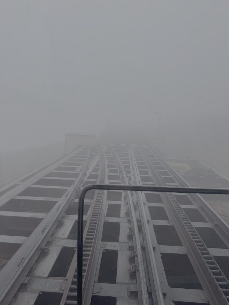 Arriving at the summit in the clouds